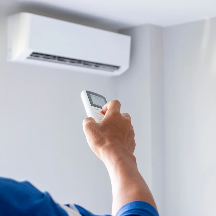 Absolute Heating & Air technicians installing a residential AC condenser at a Utah home