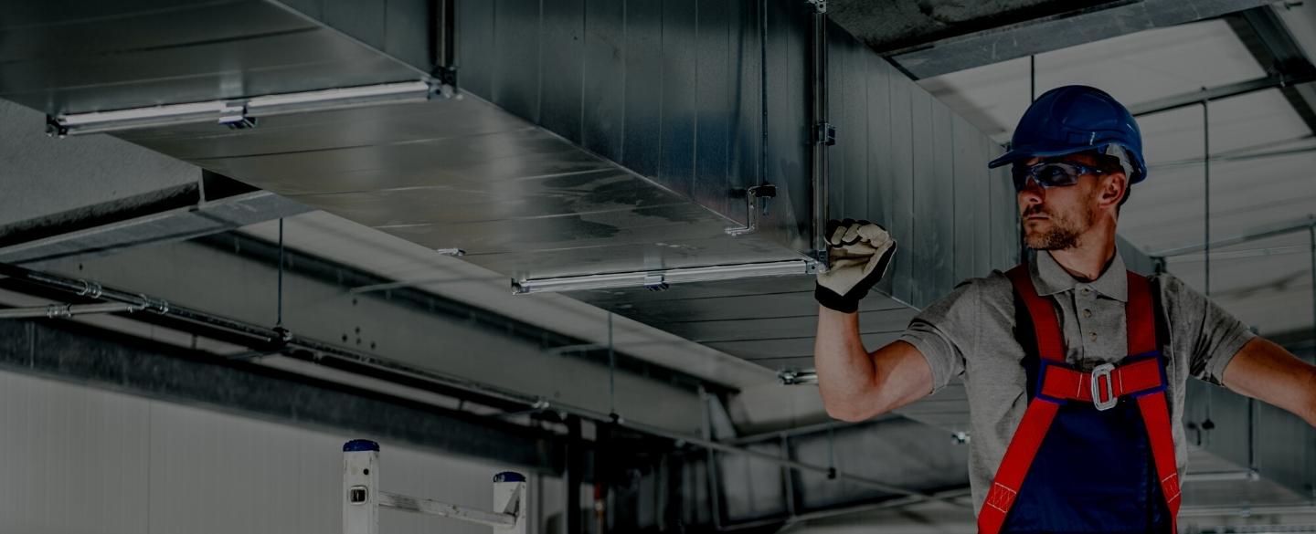 worker inspecting hvac system kearns ut
