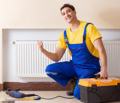 worker repairing heating panel kearns ut